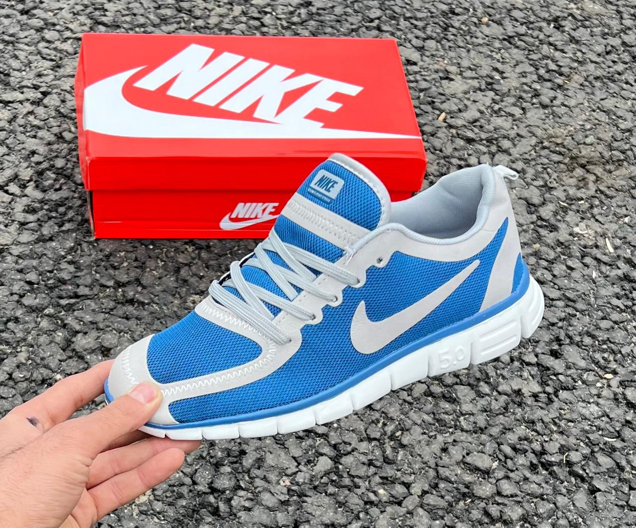 фото Мужские синие кроссовки Nike 556972 оптом с доставкой