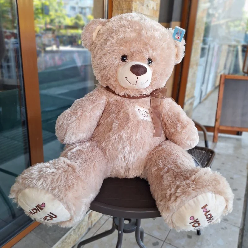 картинка Игрушка медведь с бантом 85 см от магазина Одежда+